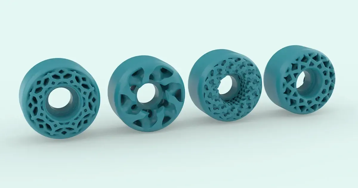 Row of teal 3D printed lattice wheels