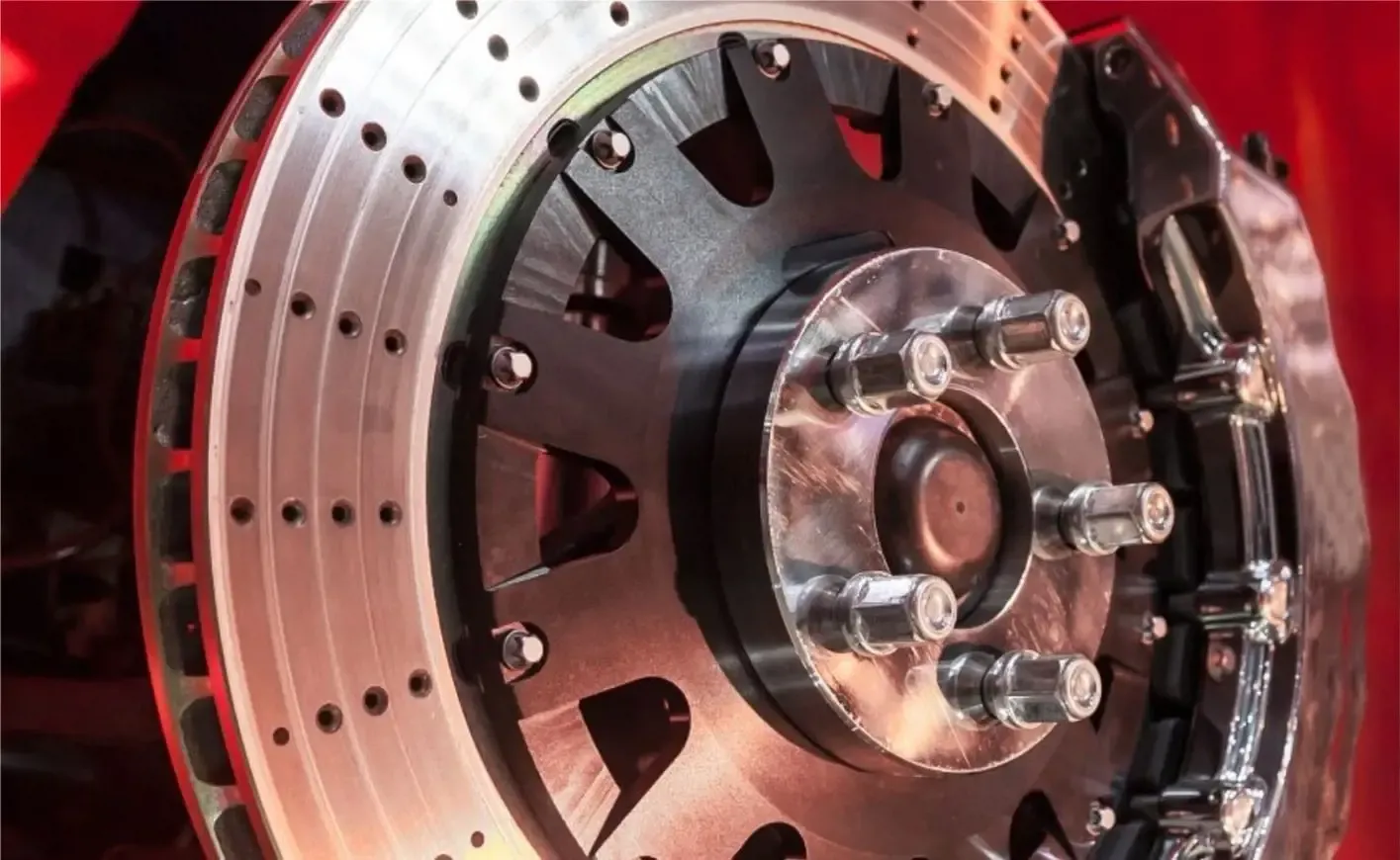 Drilled brake disc and wheel hub studs