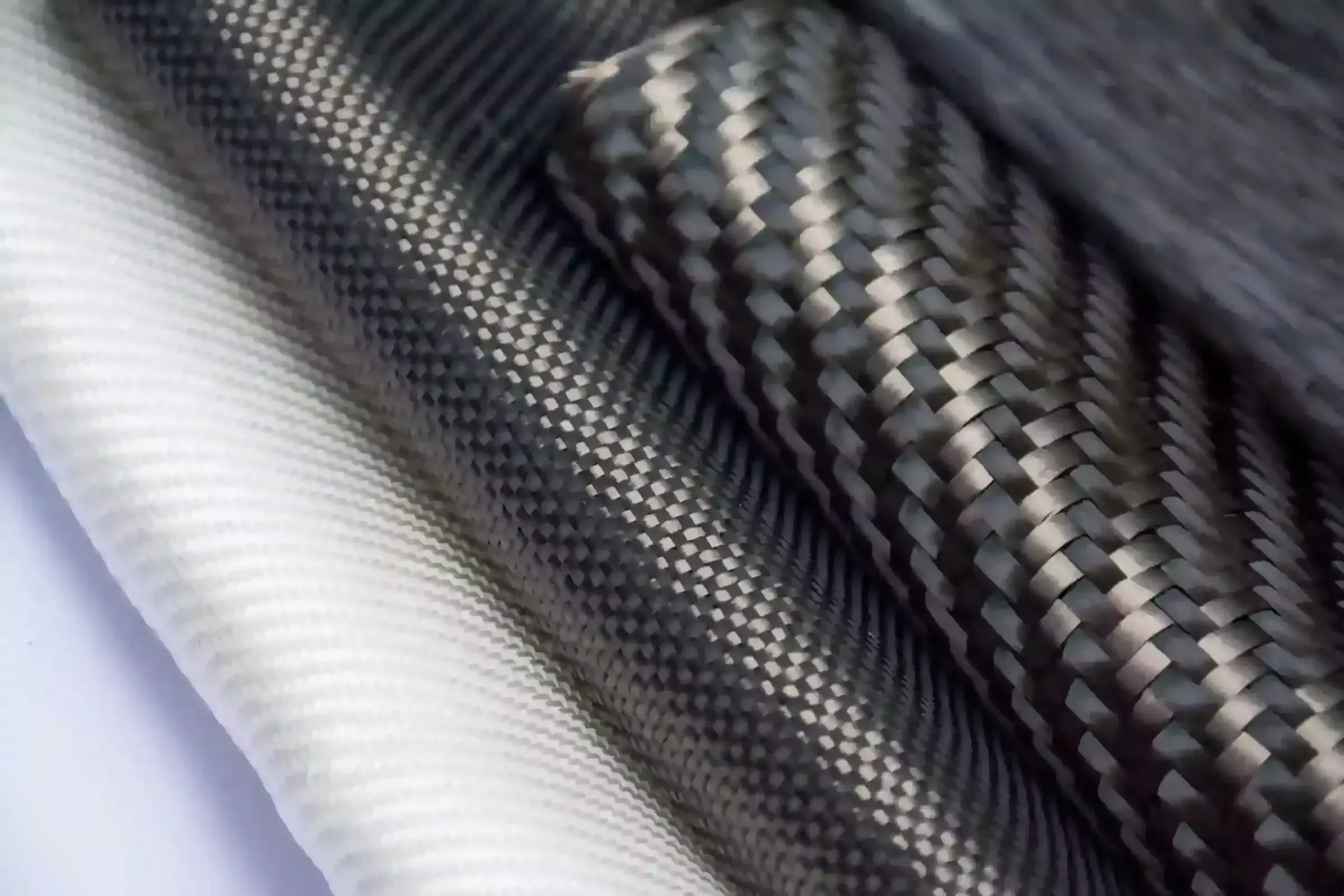 Woven carbon fiber composite tubes and fabric
