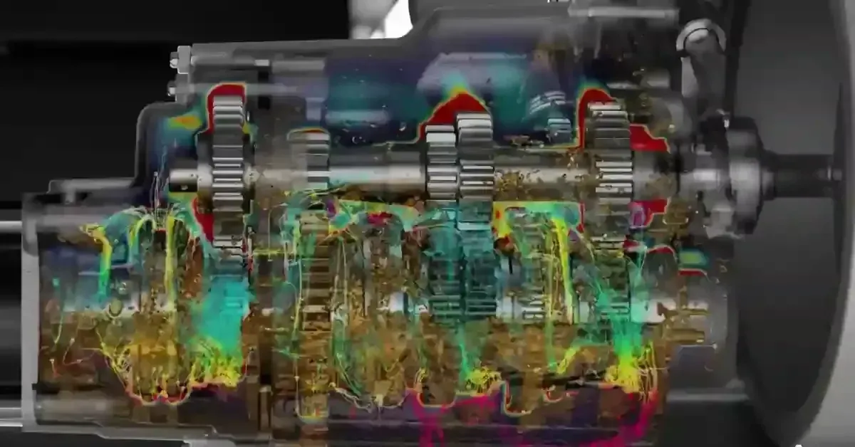 Transmission gearbox cutaway with an oil flow particle simulation