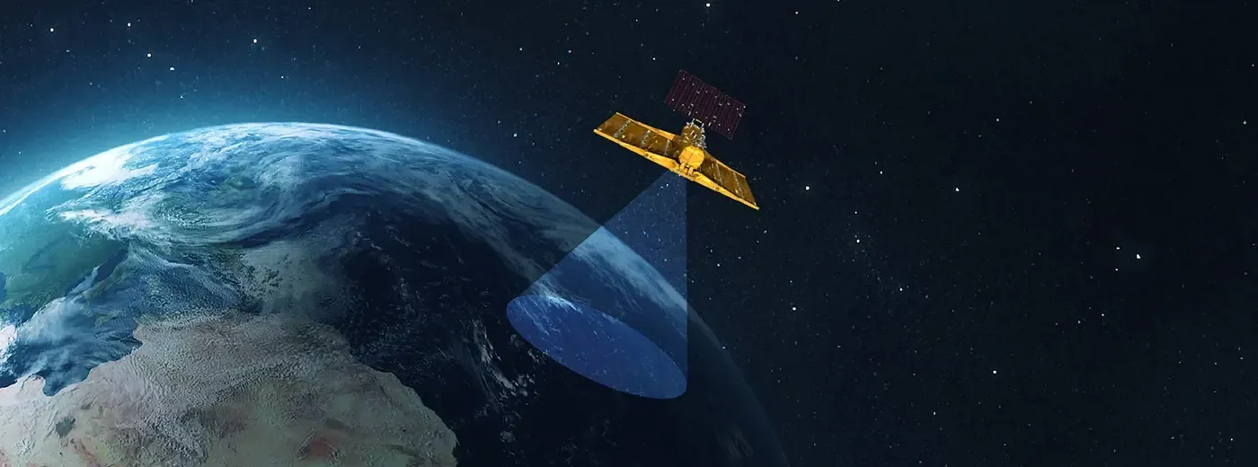 Satellite orbiting above Earth projecting an antenna beam toward the surface